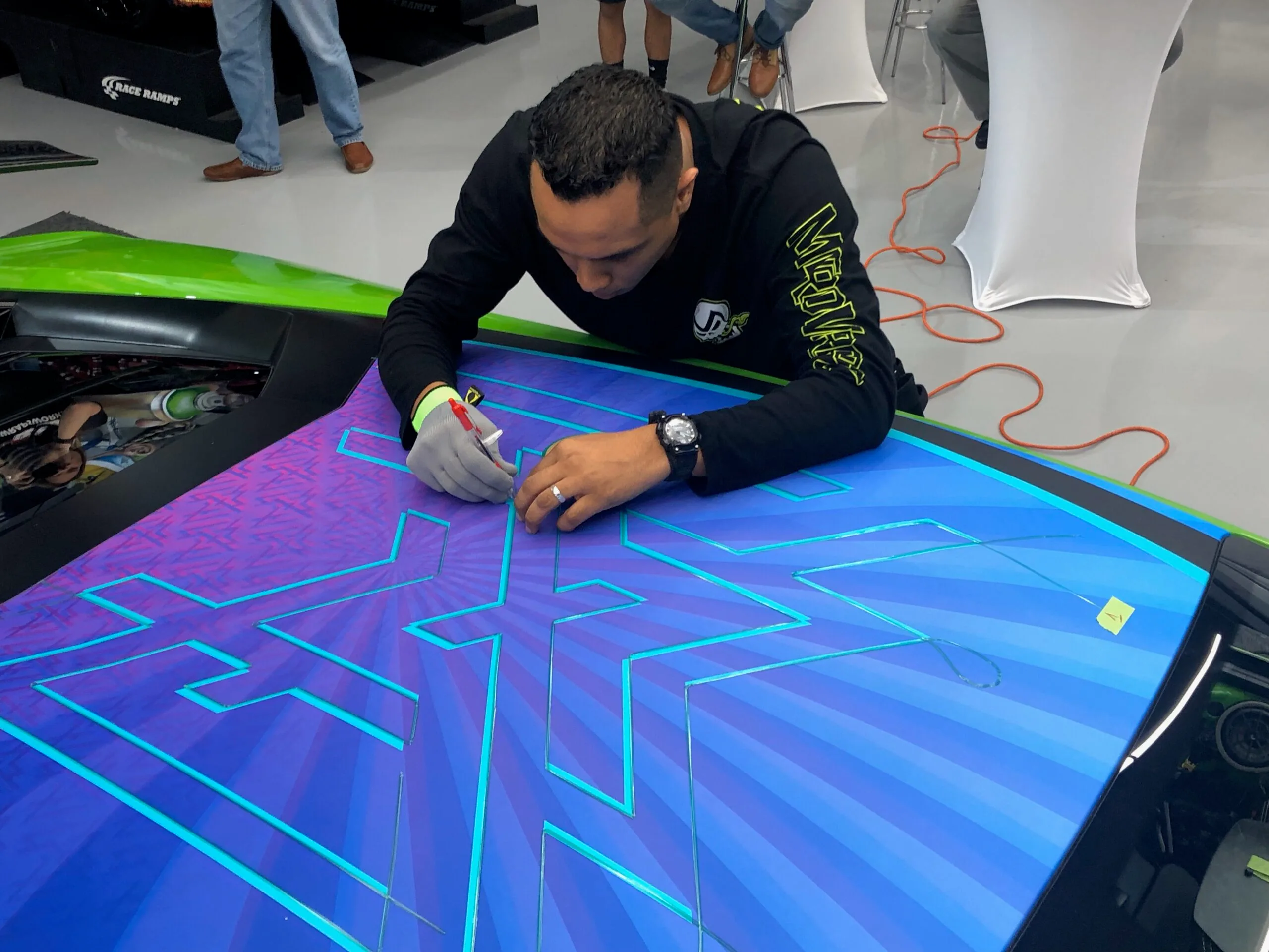 Instructor teaching car wrapping skills