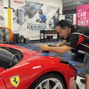 Instructor teaching polishing in auto detailing training classes