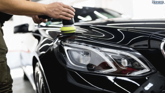 a person polishing a car