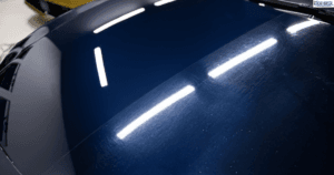 Car hood with swirl marks.